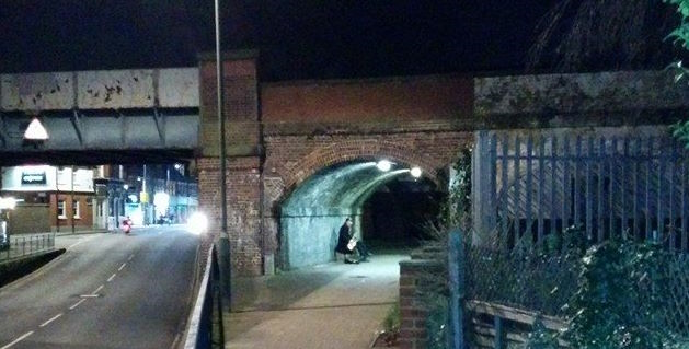 A saxophonist enjoying the reverb under a railway arch - probably also a good place to try capturing an impulse response!